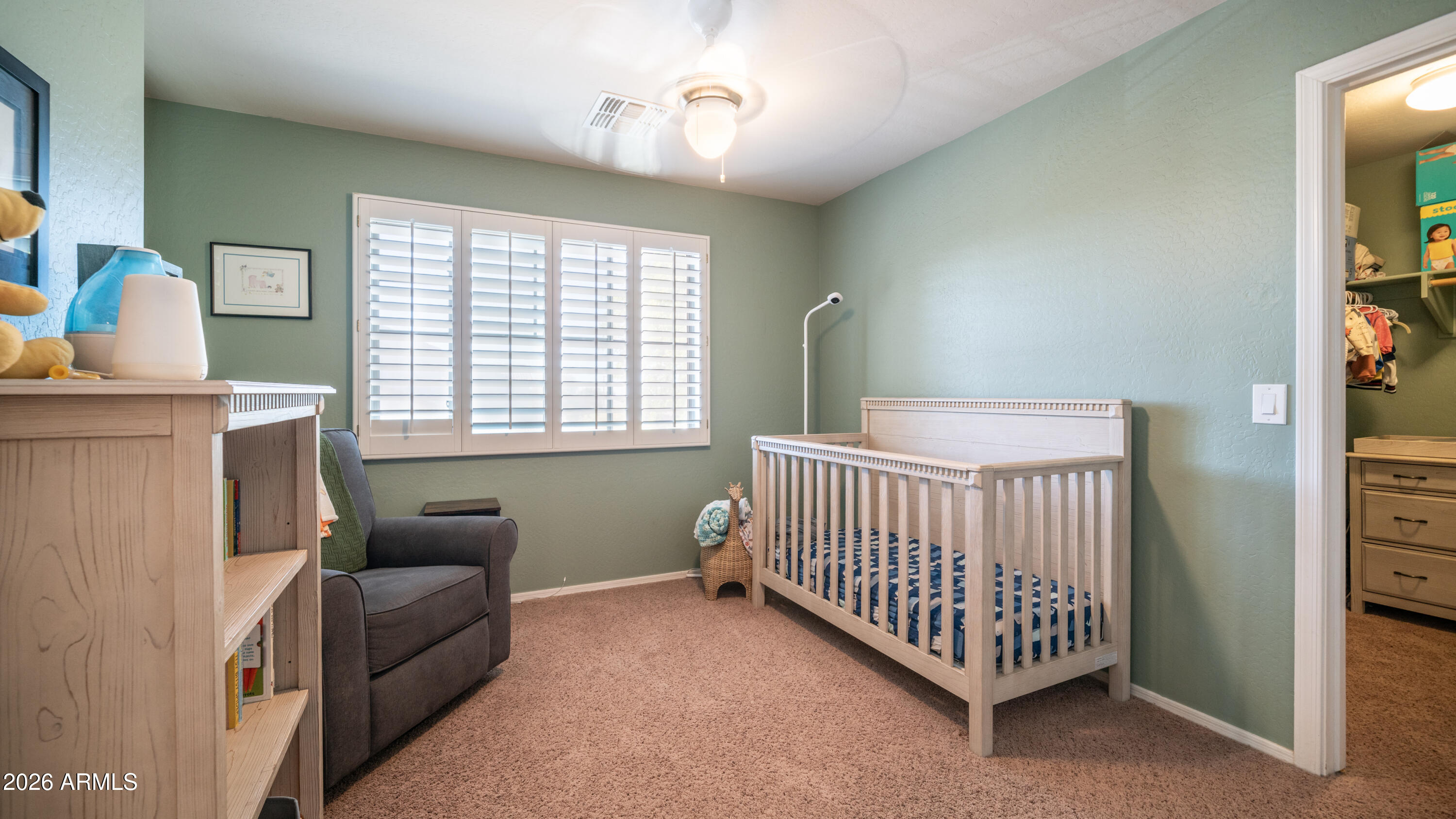 7609 South 18th Way Phoenix, AZ 85042 - Photo 21 of 32 a bedroom with furniture and a window