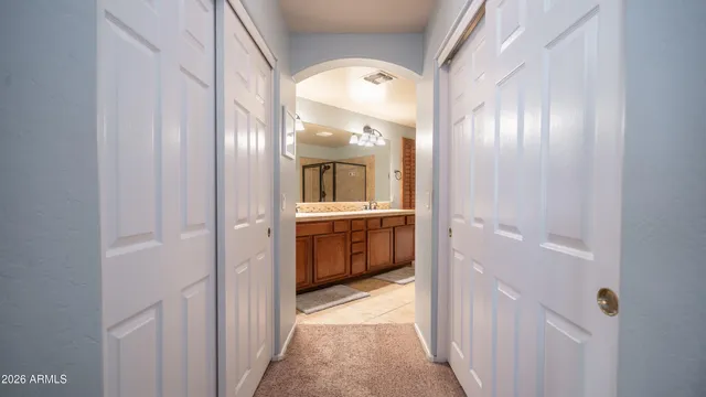a bathroom with a double vanity sink and a mirror