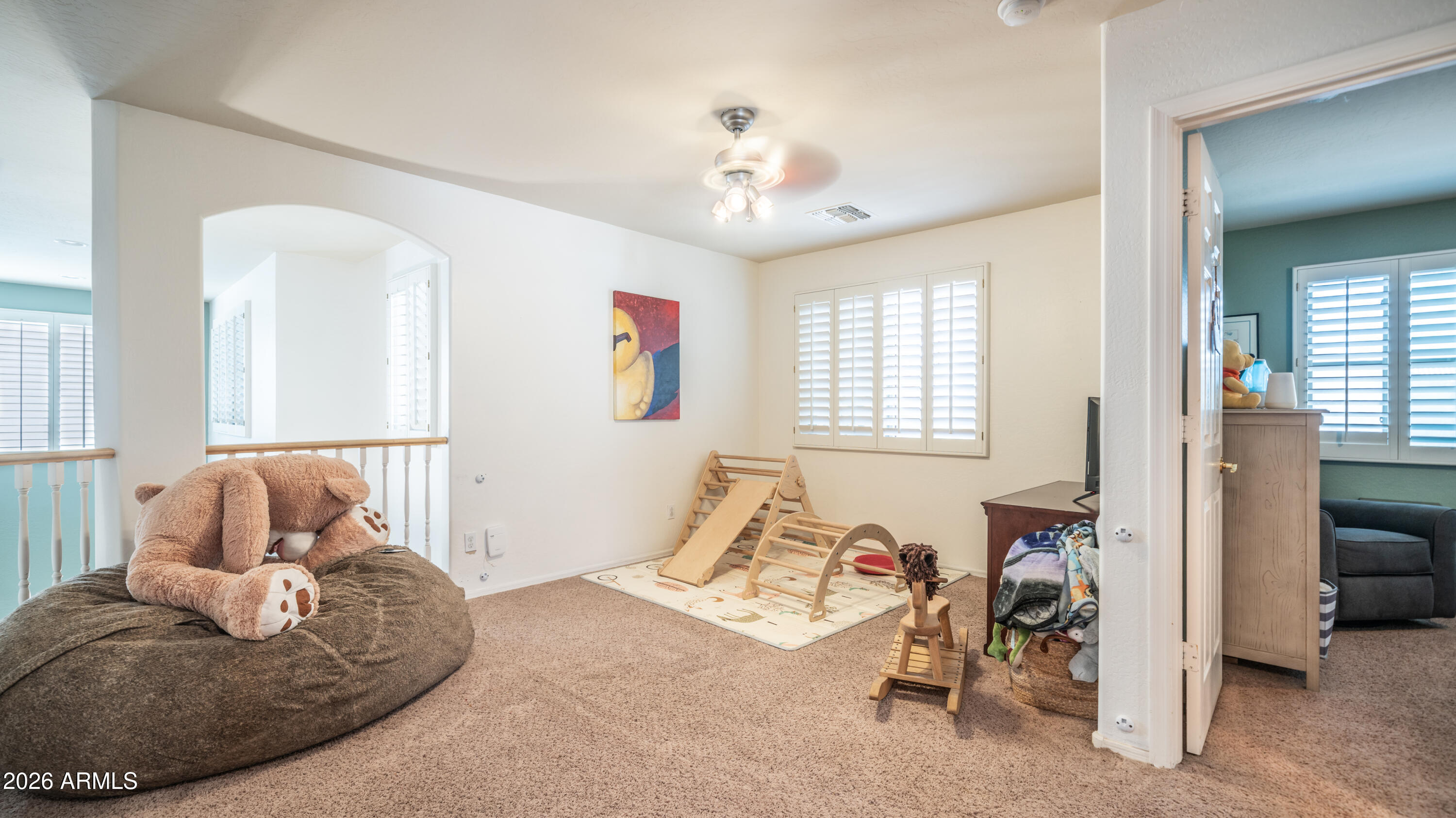 7609 South 18th Way Phoenix, AZ 85042 - Photo 24 of 32 a living room with furniture and a chandelier