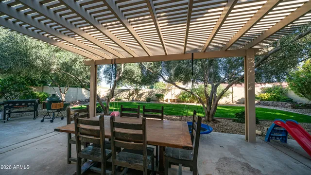 a patio with a yard table and chairs