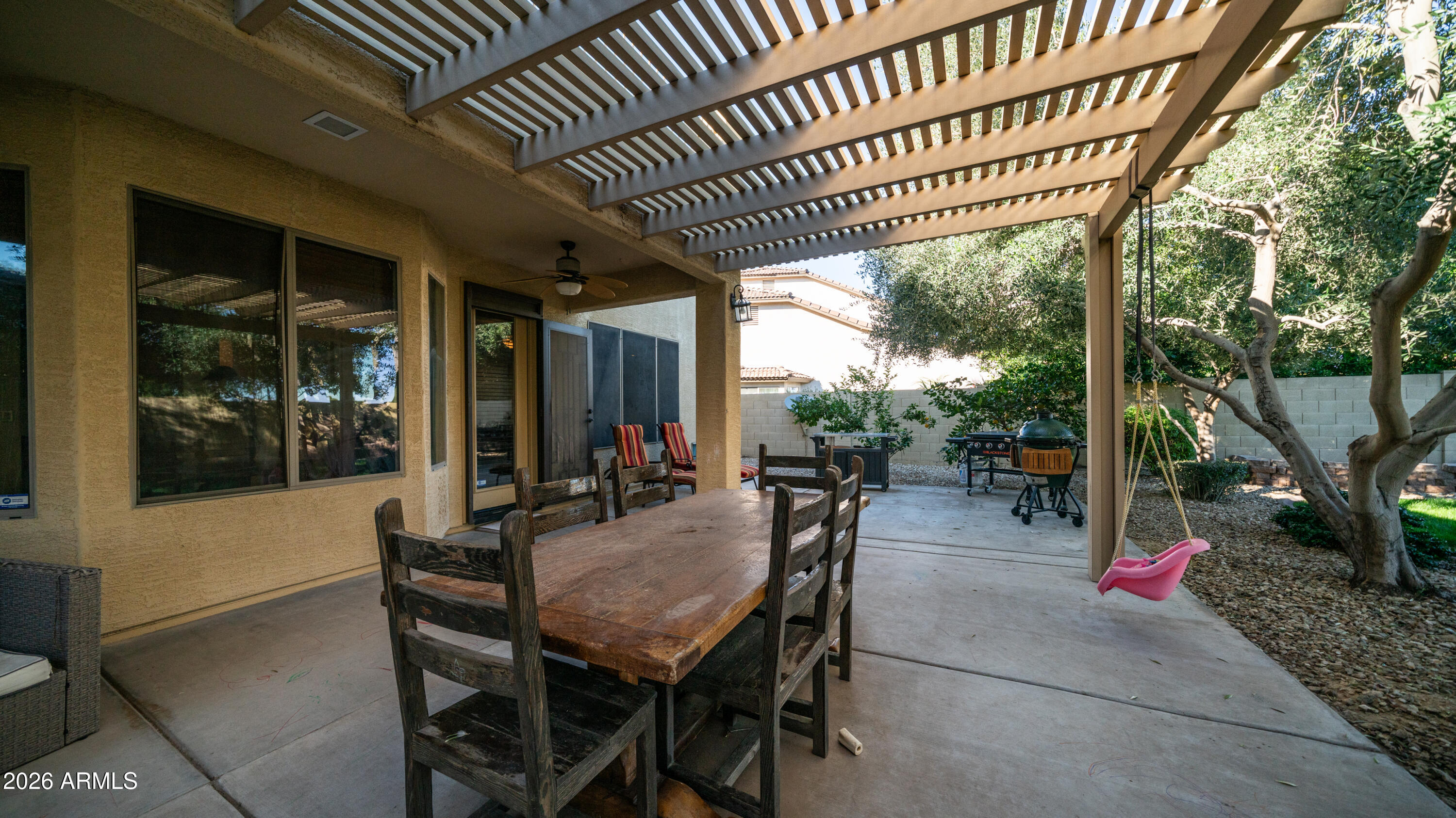 7609 South 18th Way Phoenix, AZ 85042 - Photo 8 of 32 a view of a patio with table and chairs and potted plants