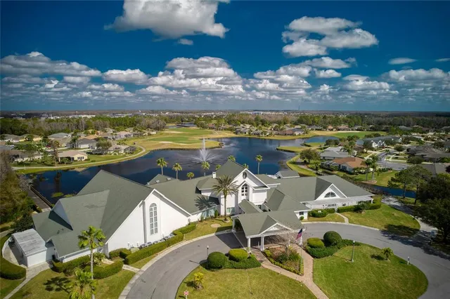 an aerial view of a house with a ocean view