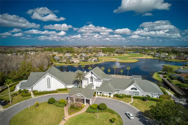 an aerial view of a house with a ocean view