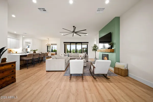a living room with furniture and a large window