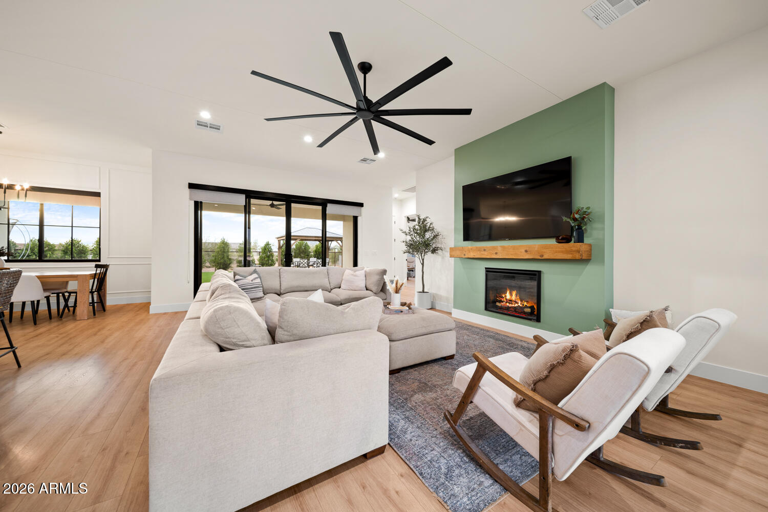 590 South Sun Road Apache Junction, AZ 85119 - Photo 13 of 68 a living room with fireplace furniture and a flat screen tv