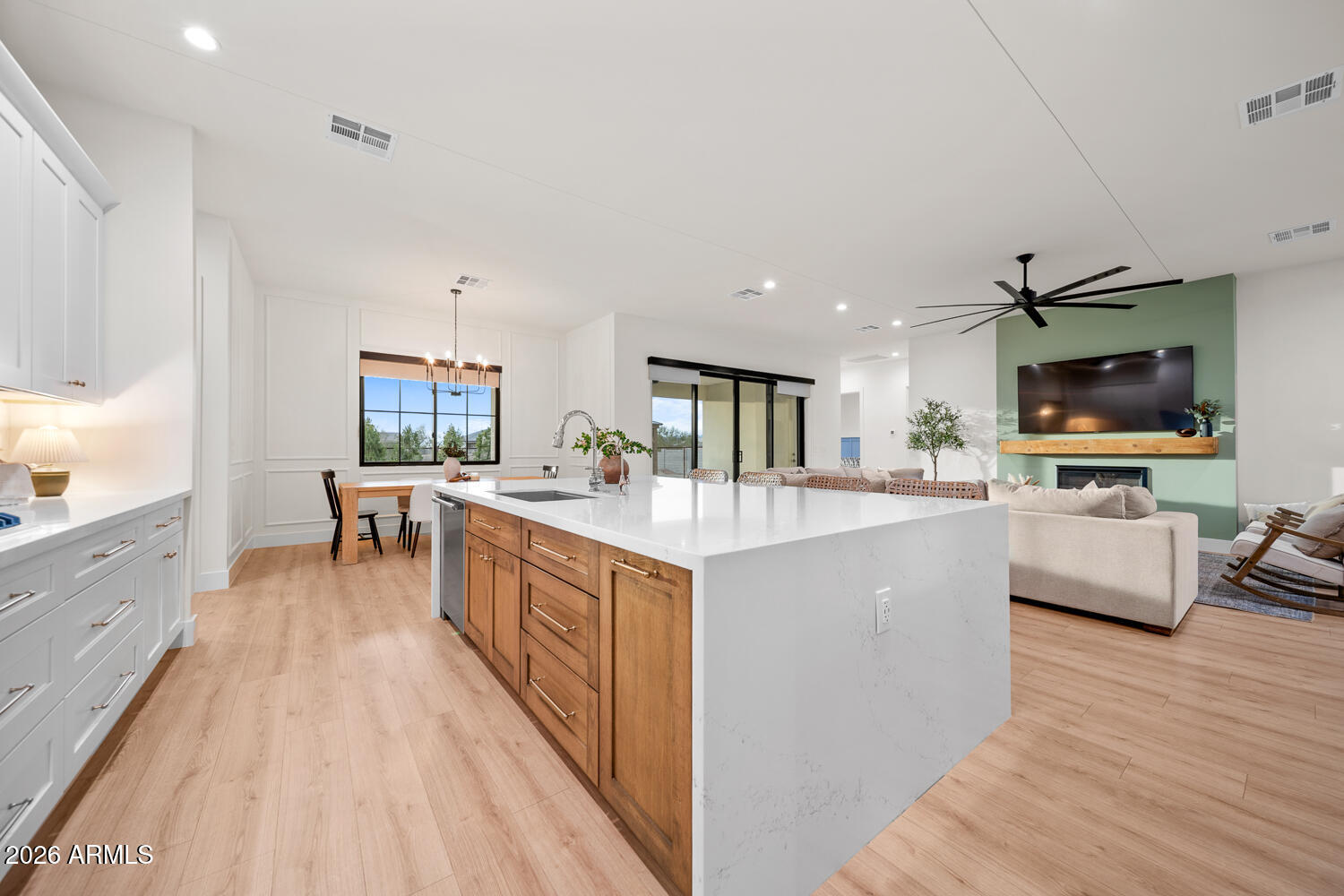 590 South Sun Road Apache Junction, AZ 85119 - Photo 18 of 68 a large living room with stainless steel appliances granite countertop a couch and a flat screen tv