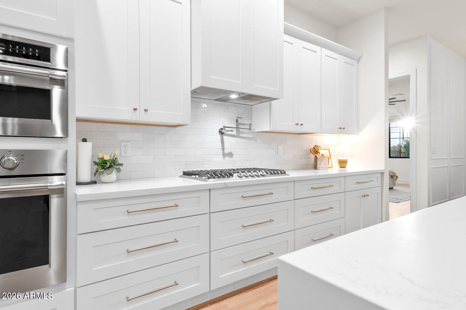 590 South Sun Road Apache Junction, AZ 85119 - Photo 20 of 68 a kitchen with granite countertop white cabinets and white appliances