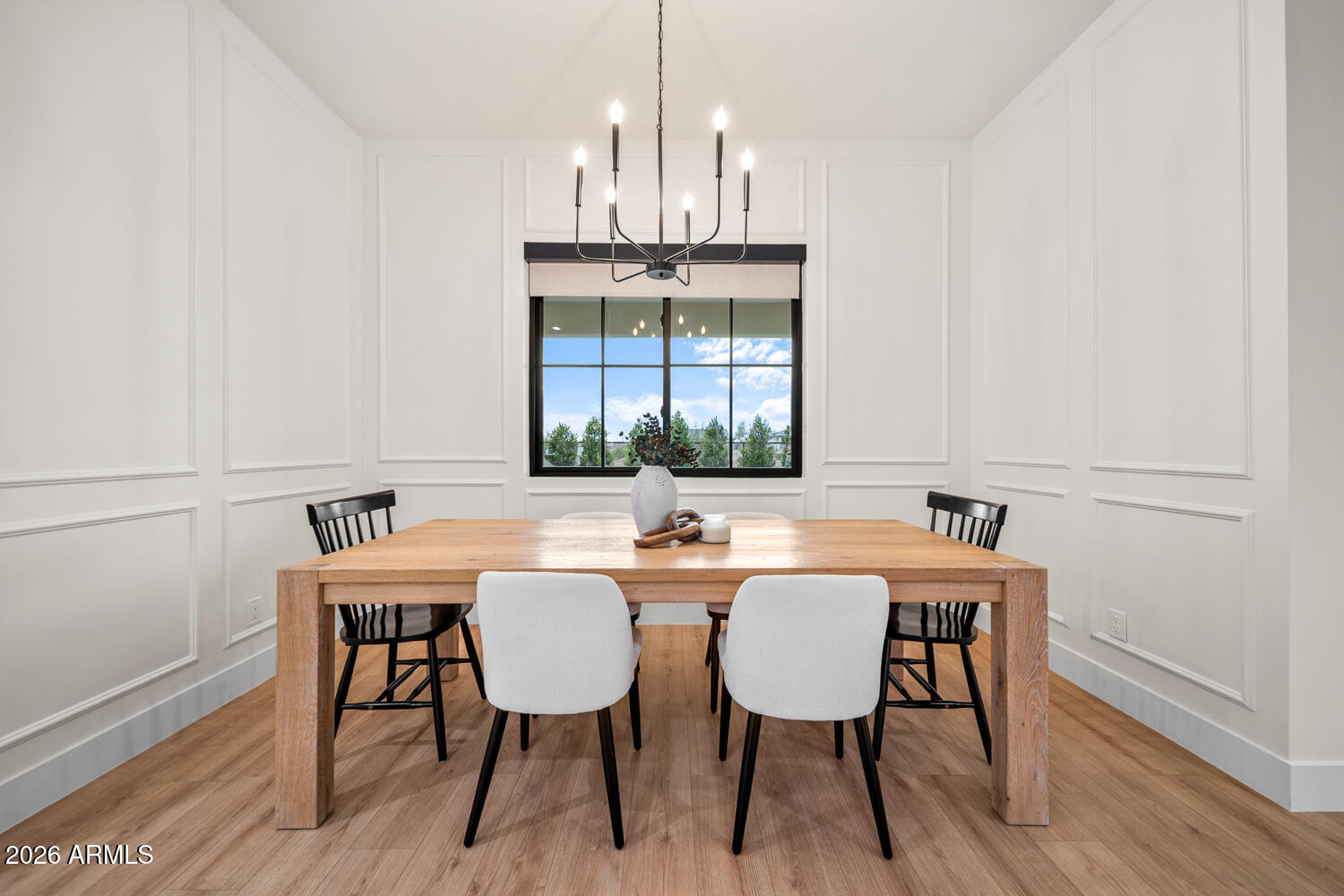 590 South Sun Road Apache Junction, AZ 85119 - Photo 25 of 68 a dining room with furniture a chandelier and wooden floor