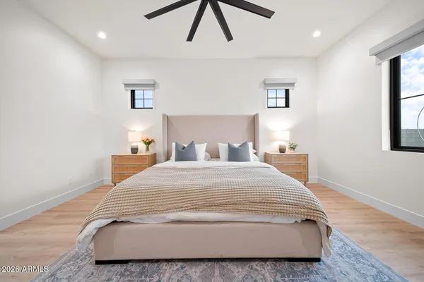 a room with walk in closet and wooden floor