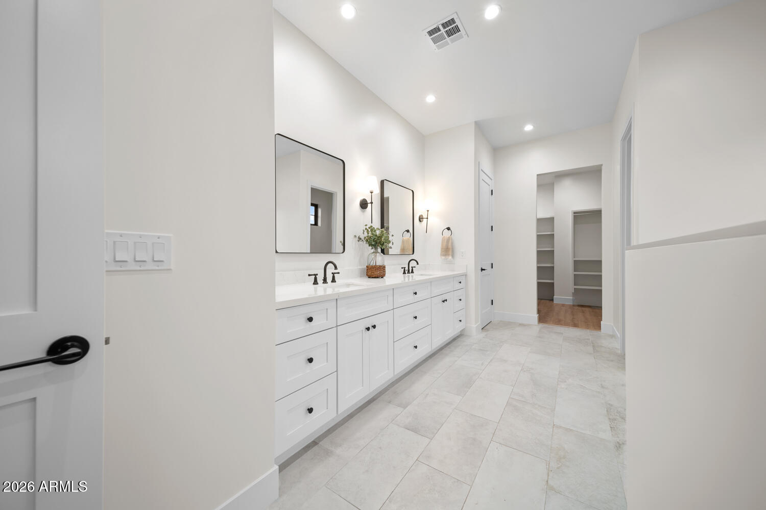 590 South Sun Road Apache Junction, AZ 85119 - Photo 29 of 68 a spacious bathroom with a double vanity sink a mirror and a shower