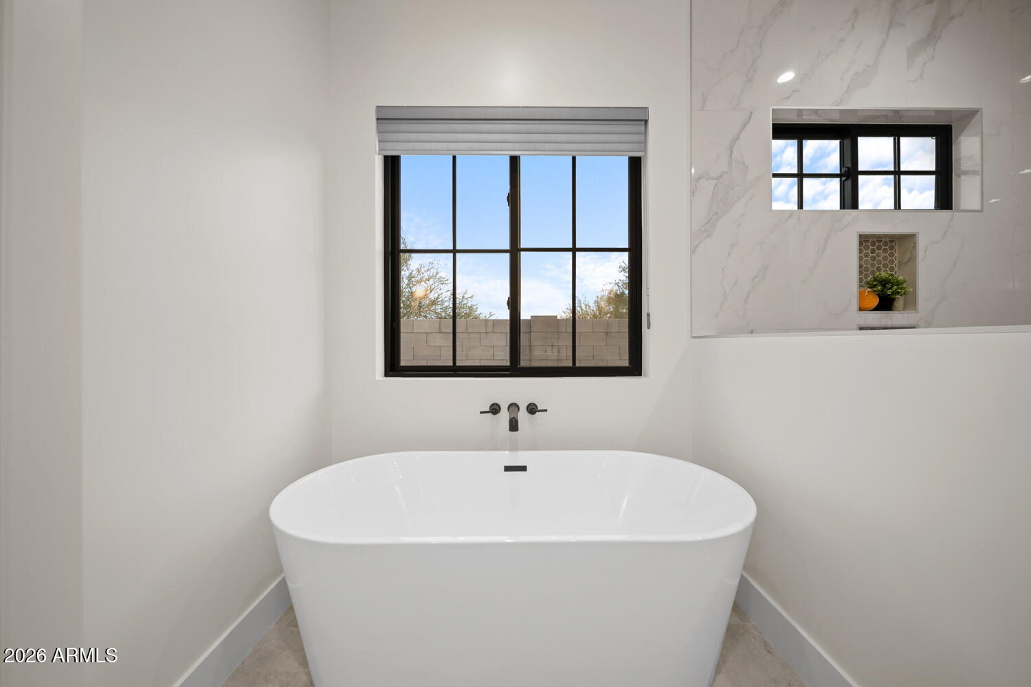 590 South Sun Road Apache Junction, AZ 85119 - Photo 31 of 68 a white bath tub sitting in a bathroom next to a window