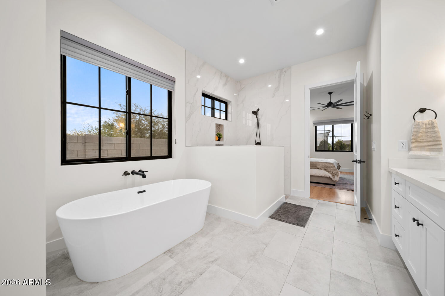 590 South Sun Road Apache Junction, AZ 85119 - Photo 32 of 68 a bathroom with a bathtub and a shower