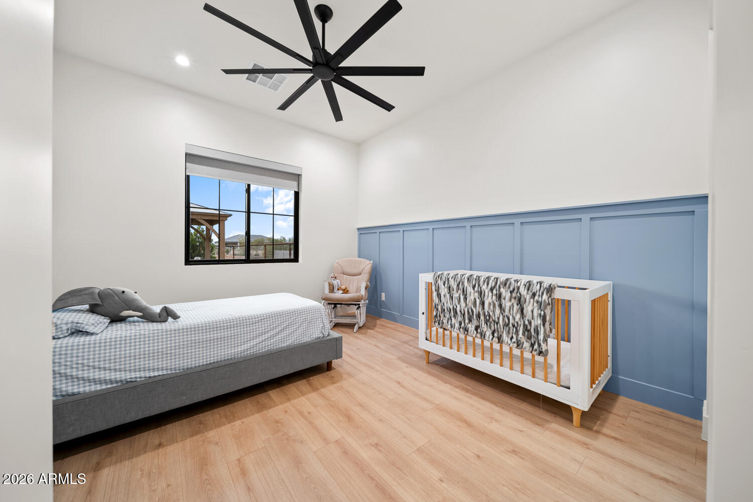 590 South Sun Road Apache Junction, AZ 85119 - Photo 38 of 68 a bedroom with a bed and wooden floor