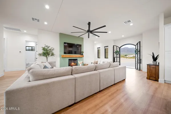 a kitchen with a table chairs refrigerator and microwave