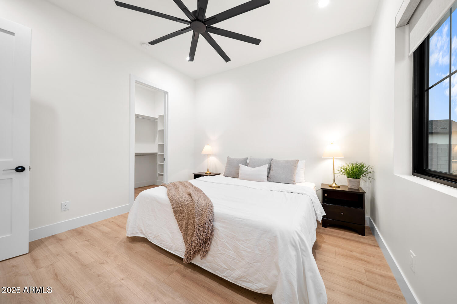 590 South Sun Road Apache Junction, AZ 85119 - Photo 40 of 68 a bedroom with a bed and a chandelier