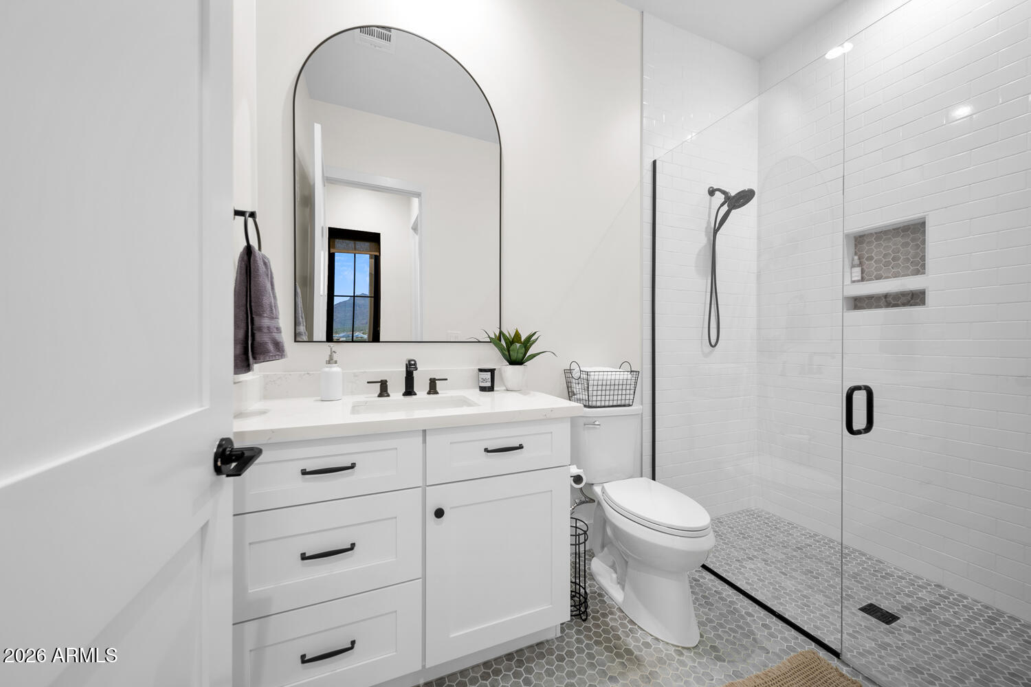 590 South Sun Road Apache Junction, AZ 85119 - Photo 42 of 68 a bathroom with a sink a toilet and a mirror