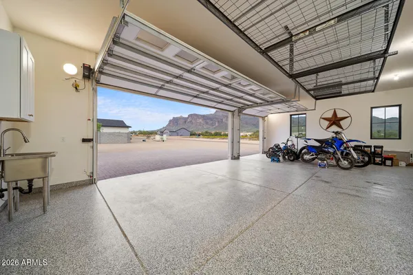 a view of an house with a yard and a garage
