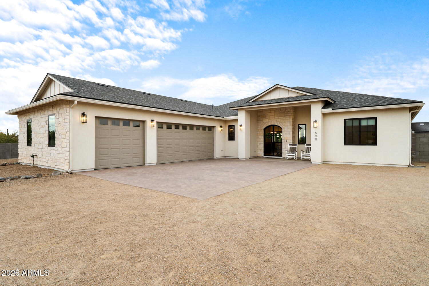 590 South Sun Road Apache Junction, AZ 85119 - Photo 49 of 68 a view of a house with a yard and garage