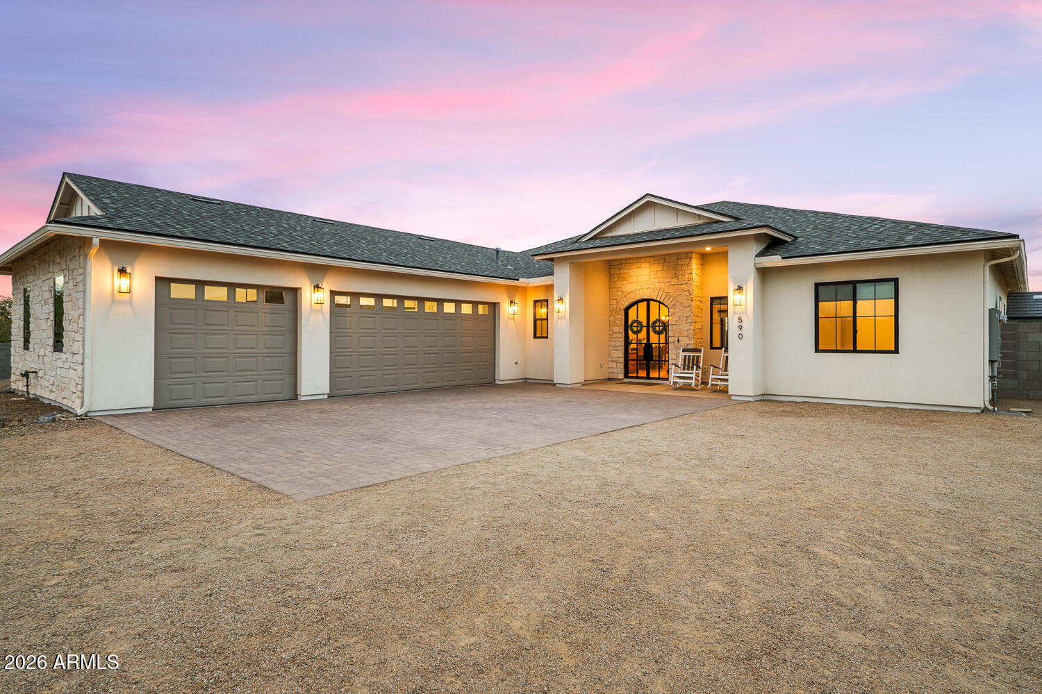 590 South Sun Road Apache Junction, AZ 85119 - Photo 50 of 68 a front view of a house with a yard and garage