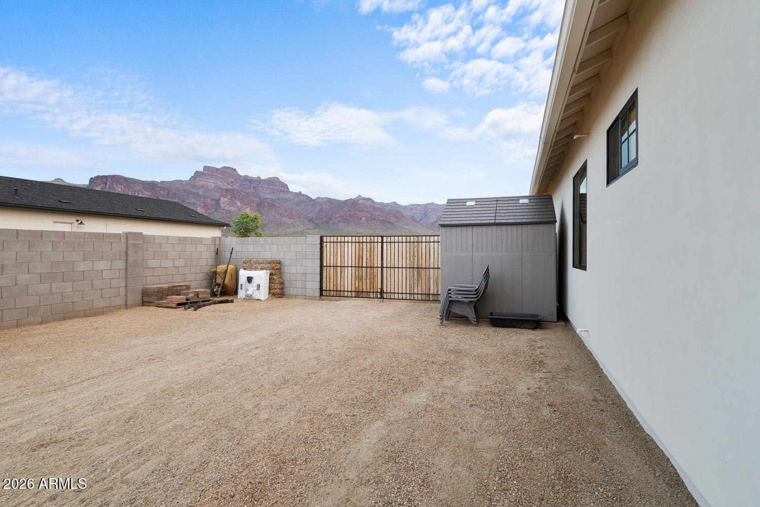 590 South Sun Road Apache Junction, AZ 85119 - Photo 61 of 68 a view of an house with a yard and a garage