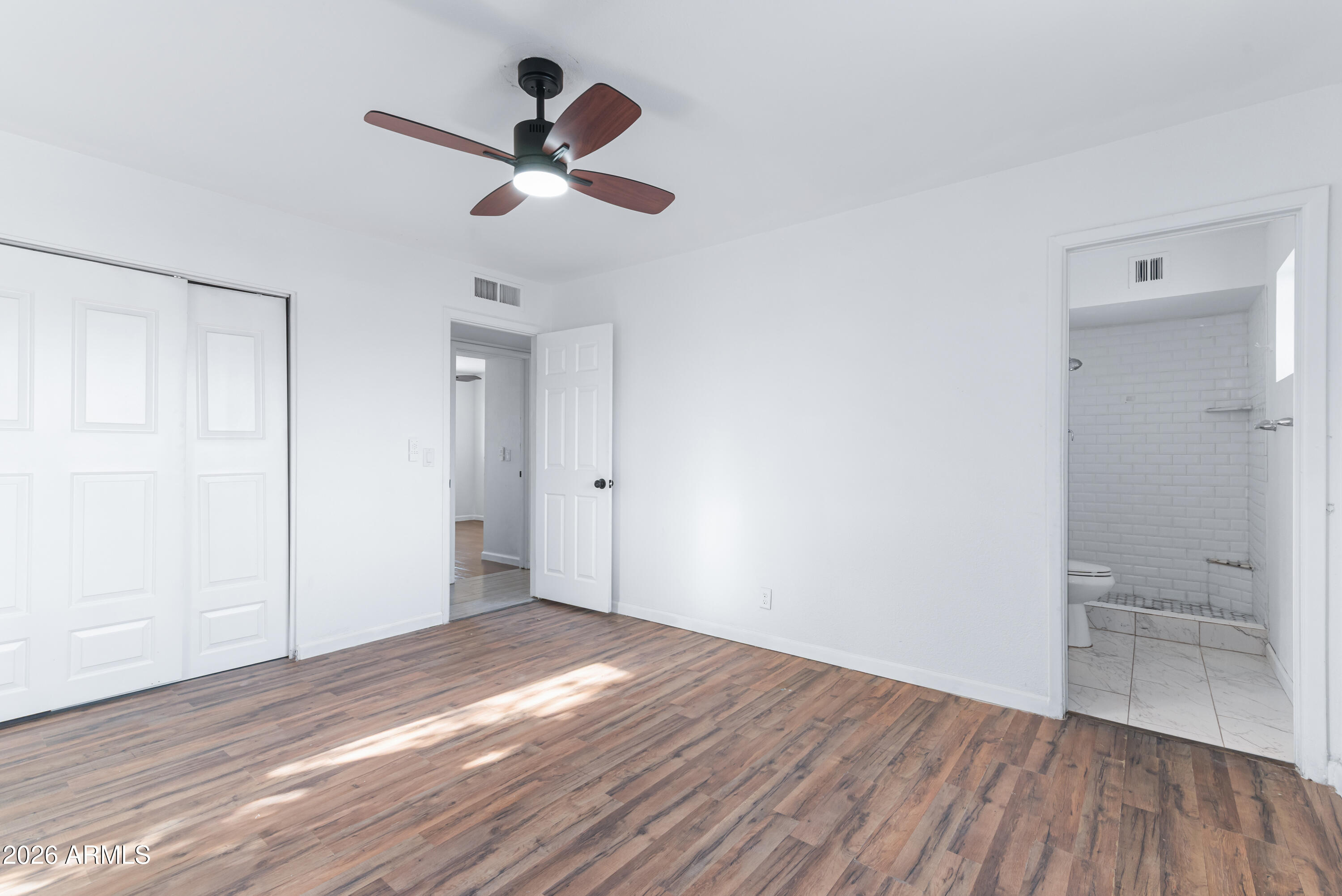 860 West McLellan Road Mesa, AZ 85201 - Photo 13 of 26 a view of empty room with wooden floor