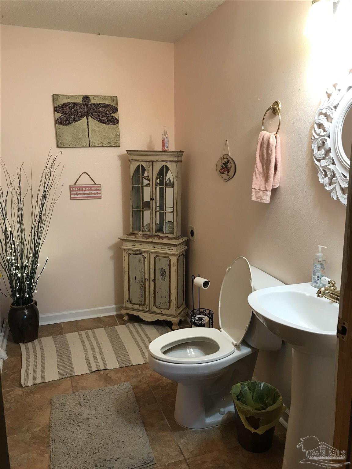 2529 Molino Road Molino, FL 32577 - Photo 19 of 43 a bathroom with a toilet