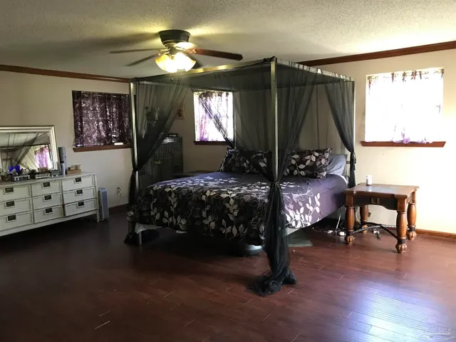 a bathroom with a glass shower door and mirror