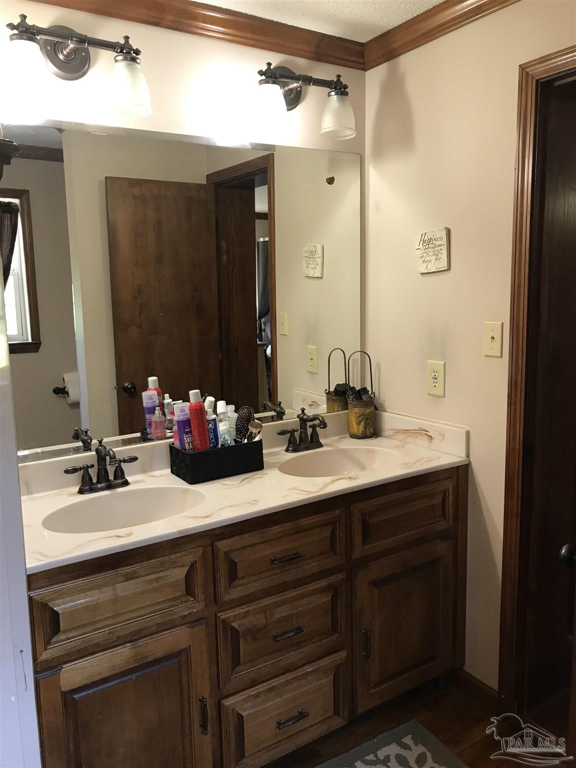 2529 Molino Road Molino, FL 32577 - Photo 30 of 43 a bathroom with a double vanity sink mirror and double