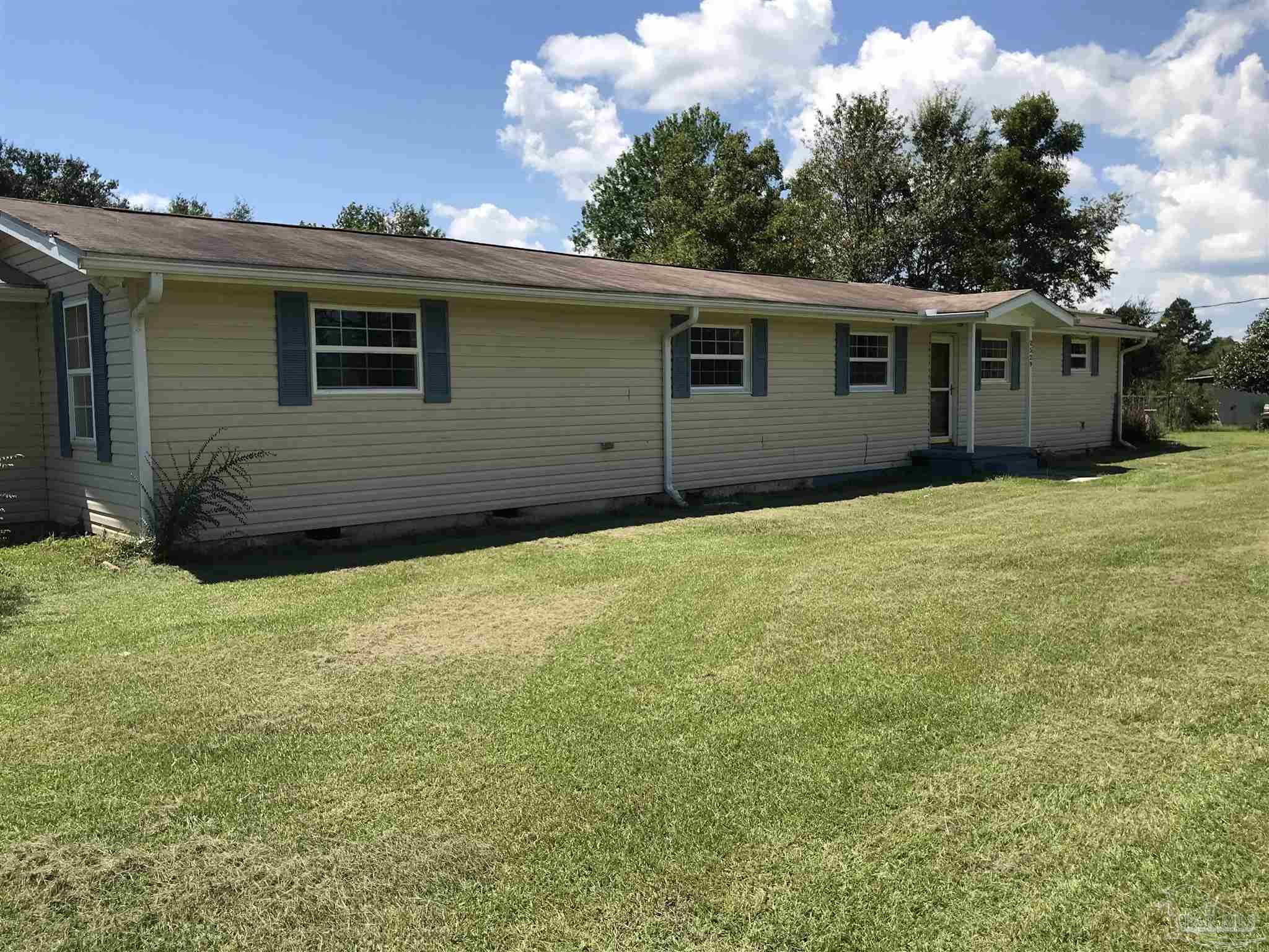 2529 Molino Road Molino, FL 32577 - Photo 3 of 43 a view of a house with a backyard