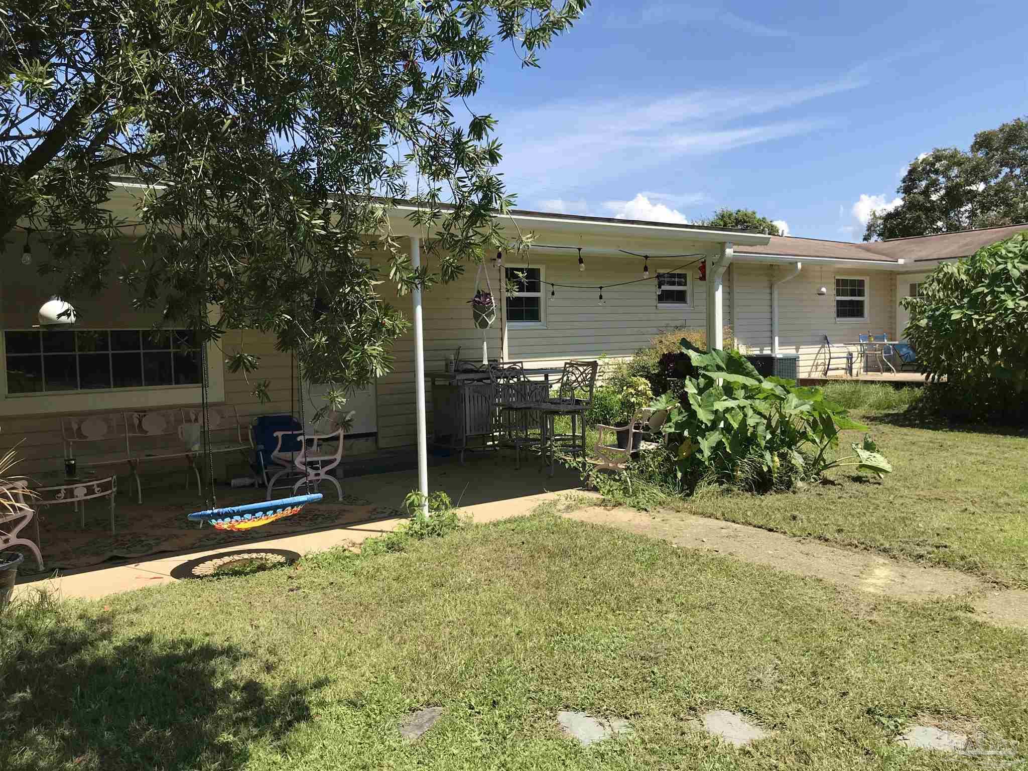 2529 Molino Road Molino, FL 32577 - Photo 34 of 43 front view of a house with a yard