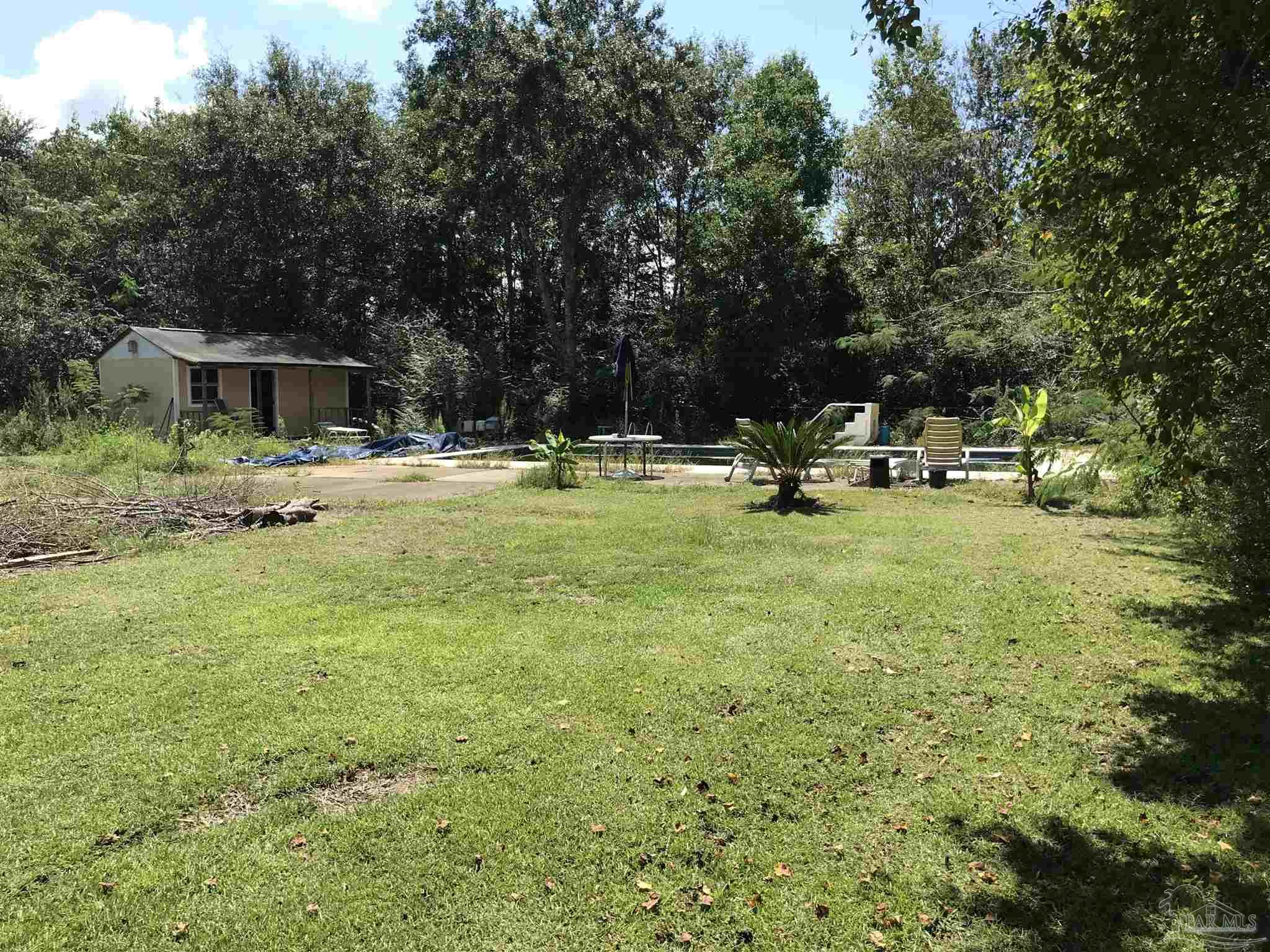2529 Molino Road Molino, FL 32577 - Photo 36 of 43 a view of a house with backyard and sitting area