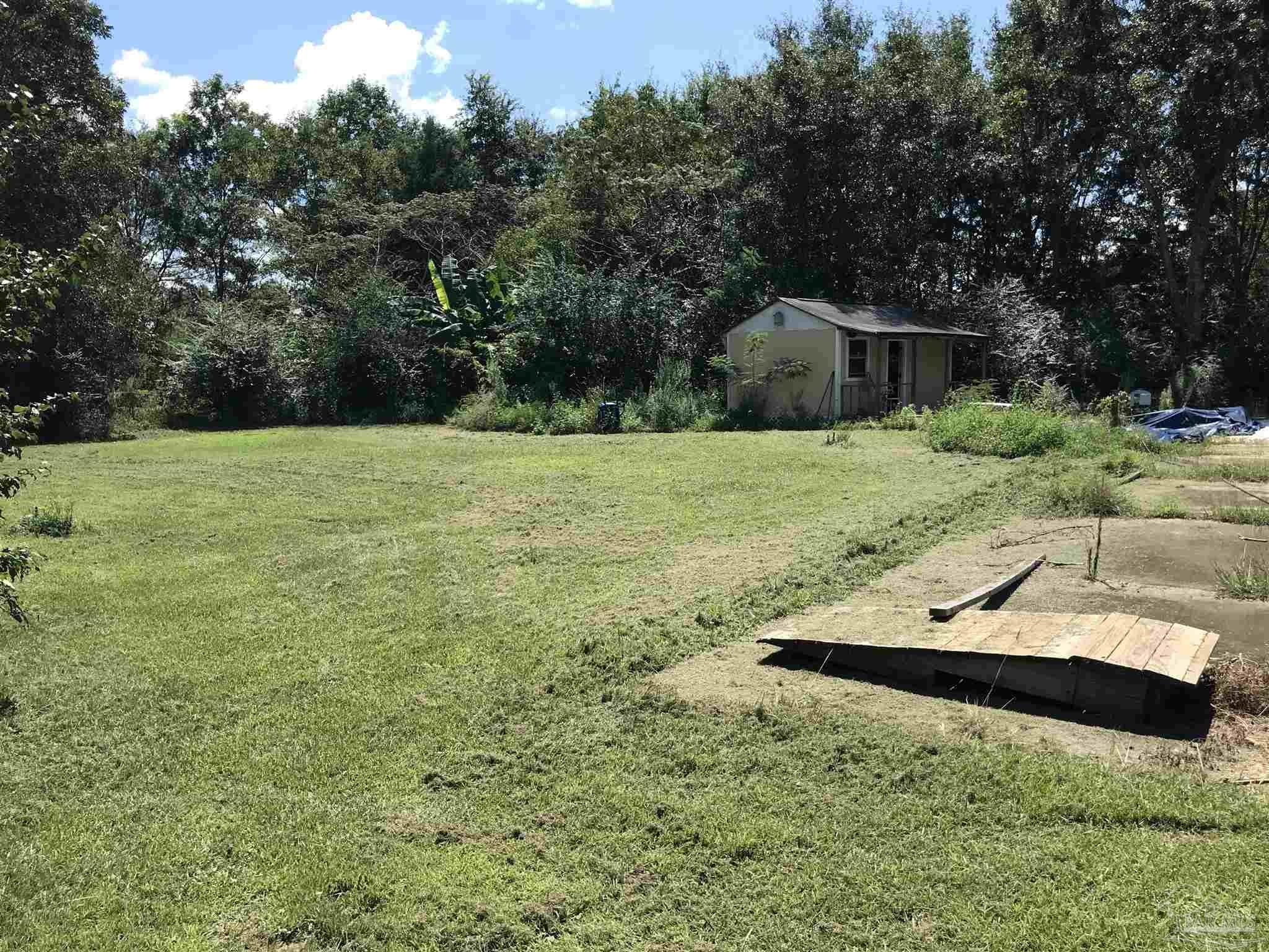2529 Molino Road Molino, FL 32577 - Photo 37 of 43 a aerial view of a house with a yard and trees