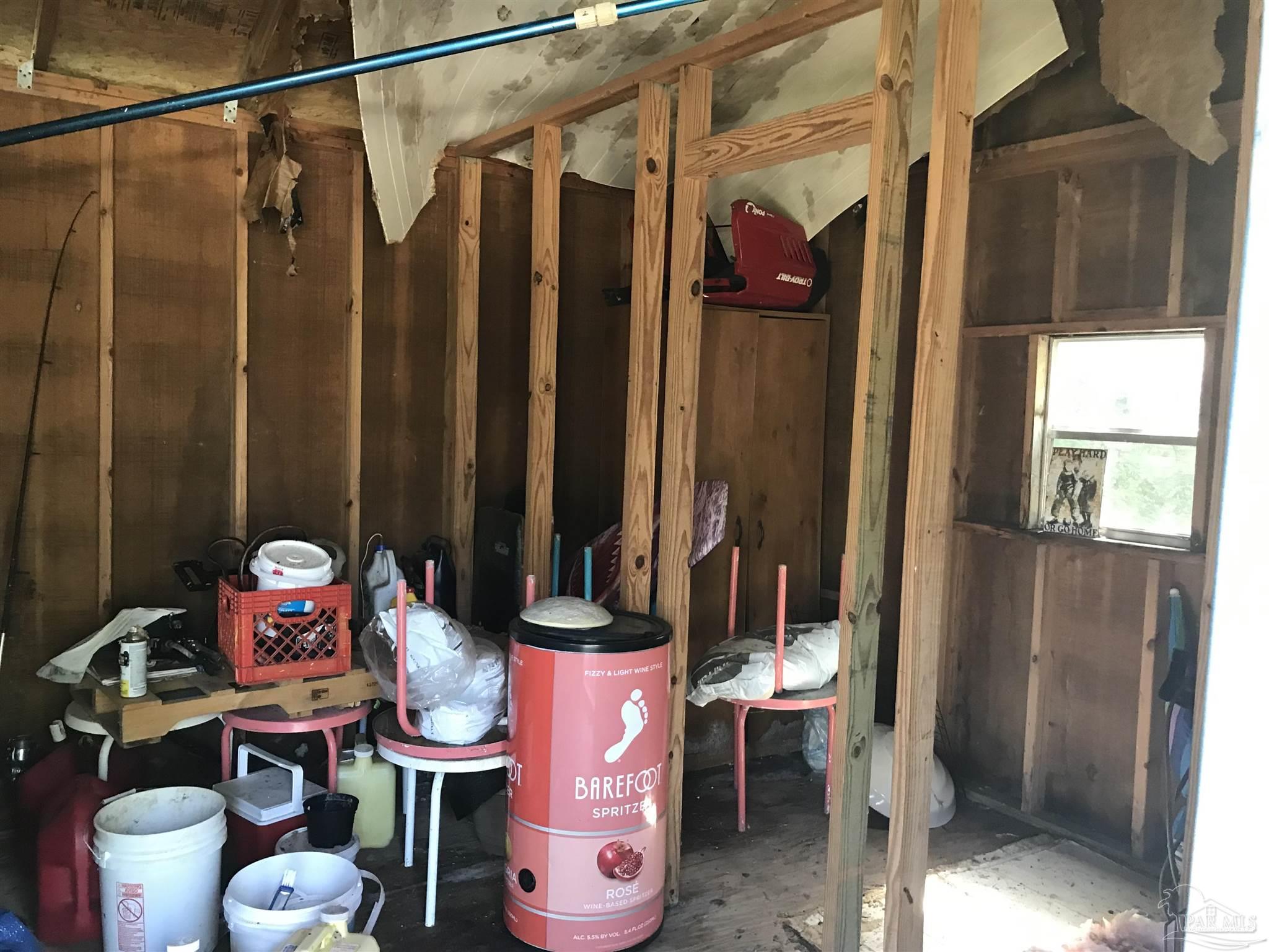 2529 Molino Road Molino, FL 32577 - Photo 42 of 43 a bathroom with a sink mirror and toilet