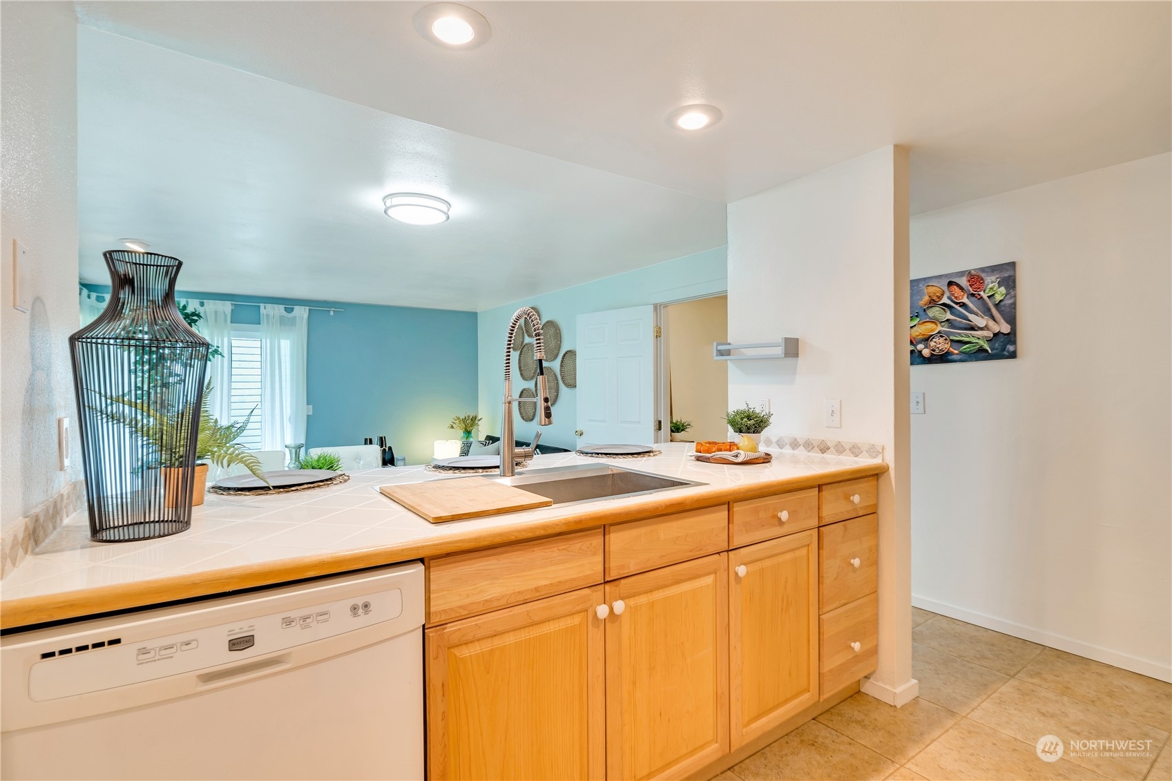 14401 Southeast Petrovitsky Road, Unit B101 Renton, WA 98058 - Photo 15 of 22 a bathroom with a sink and a mirror