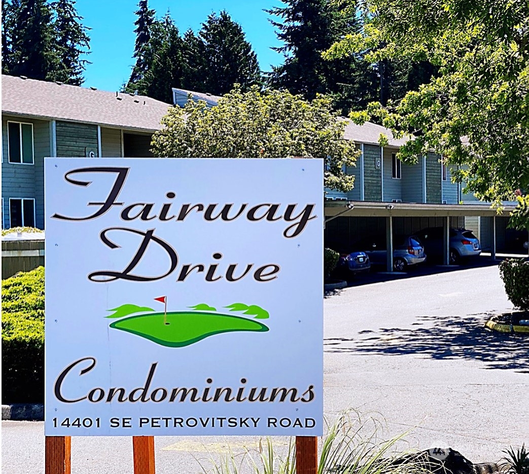 14401 Southeast Petrovitsky Road, Unit B101 Renton, WA 98058 - Photo 20 of 22 a sign that is on the wall of the building