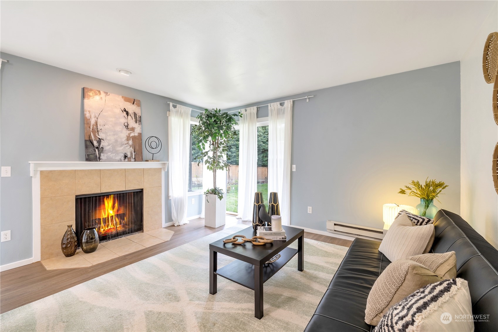 14401 Southeast Petrovitsky Road, Unit B101 Renton, WA 98058 - Photo 2 of 22 a living room with furniture and a fireplace