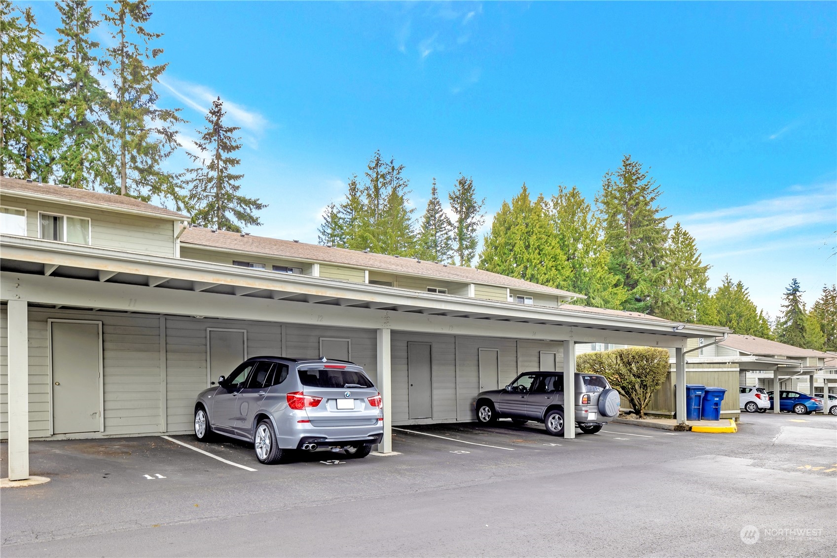 14401 Southeast Petrovitsky Road, Unit B101 Renton, WA 98058 - Photo 21 of 22 a car parked in front of a building