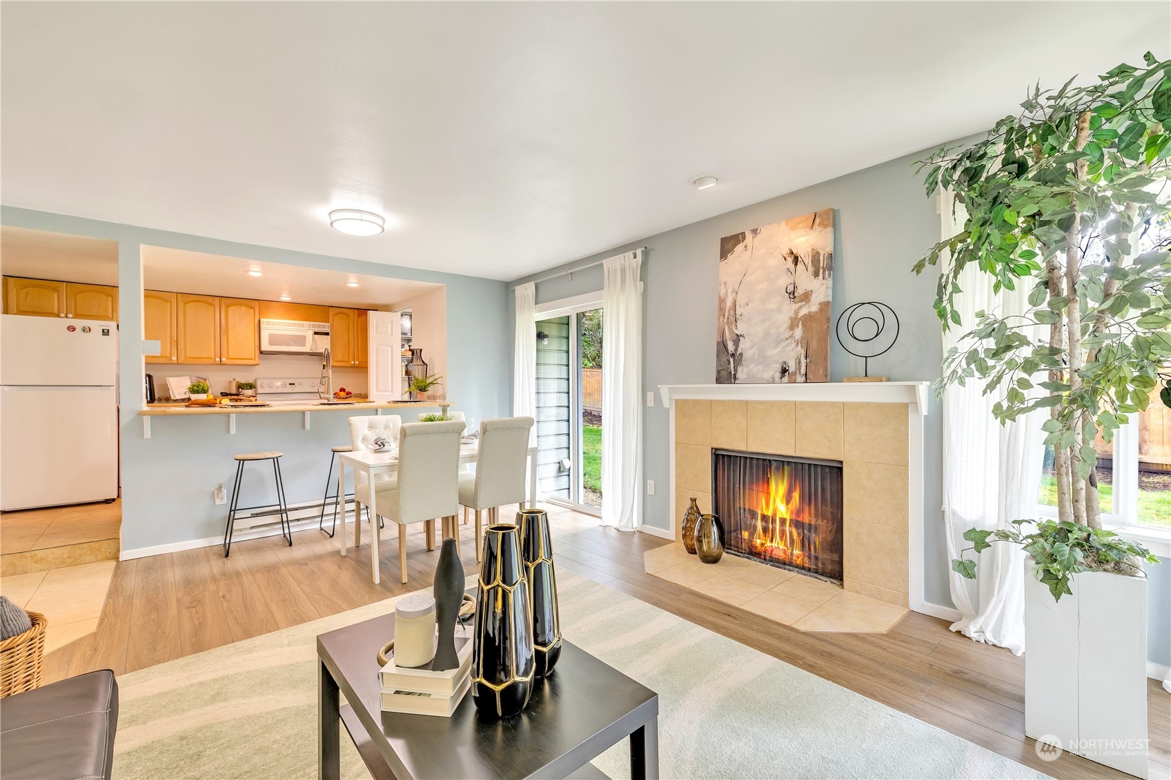 14401 Southeast Petrovitsky Road, Unit B101 Renton, WA 98058 - Photo 3 of 22 a living room with furniture and a fireplace