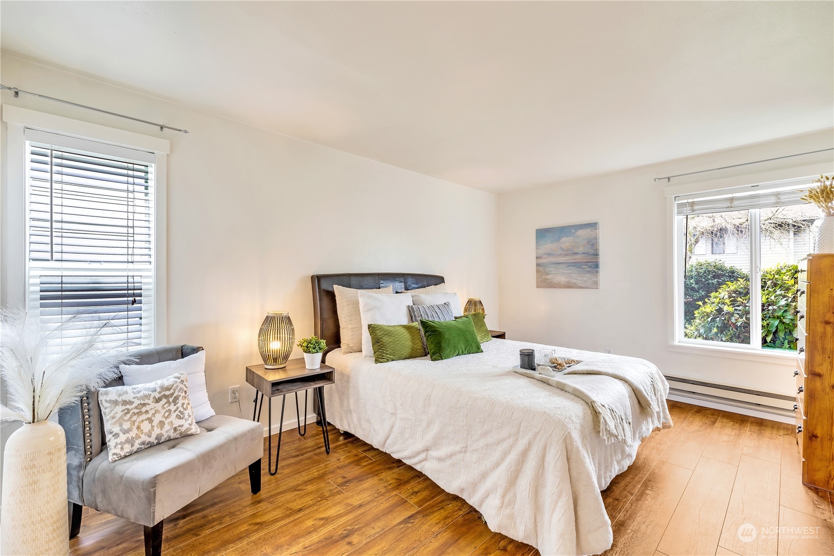 14401 Southeast Petrovitsky Road, Unit B101 Renton, WA 98058 - Photo 7 of 22 a bedroom with a bed and wooden floor