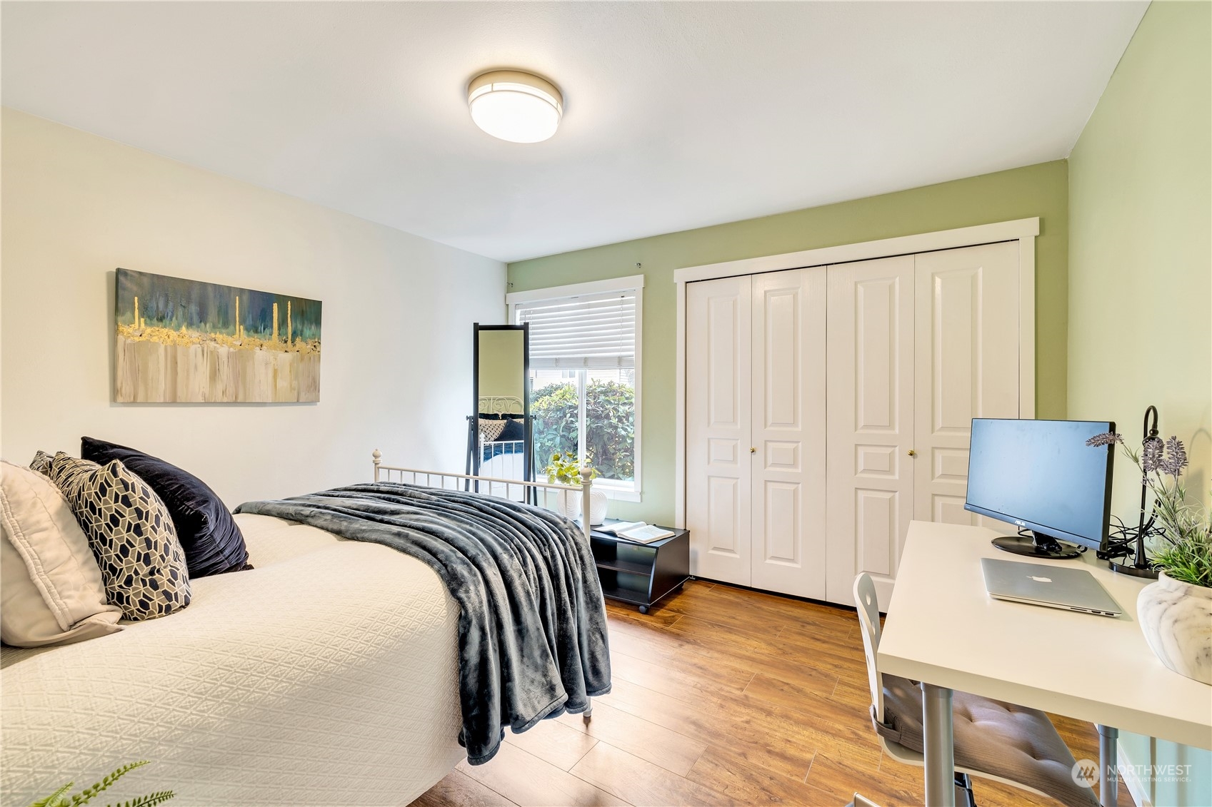 14401 Southeast Petrovitsky Road, Unit B101 Renton, WA 98058 - Photo 8 of 22 a bedroom with a bed and wooden floor