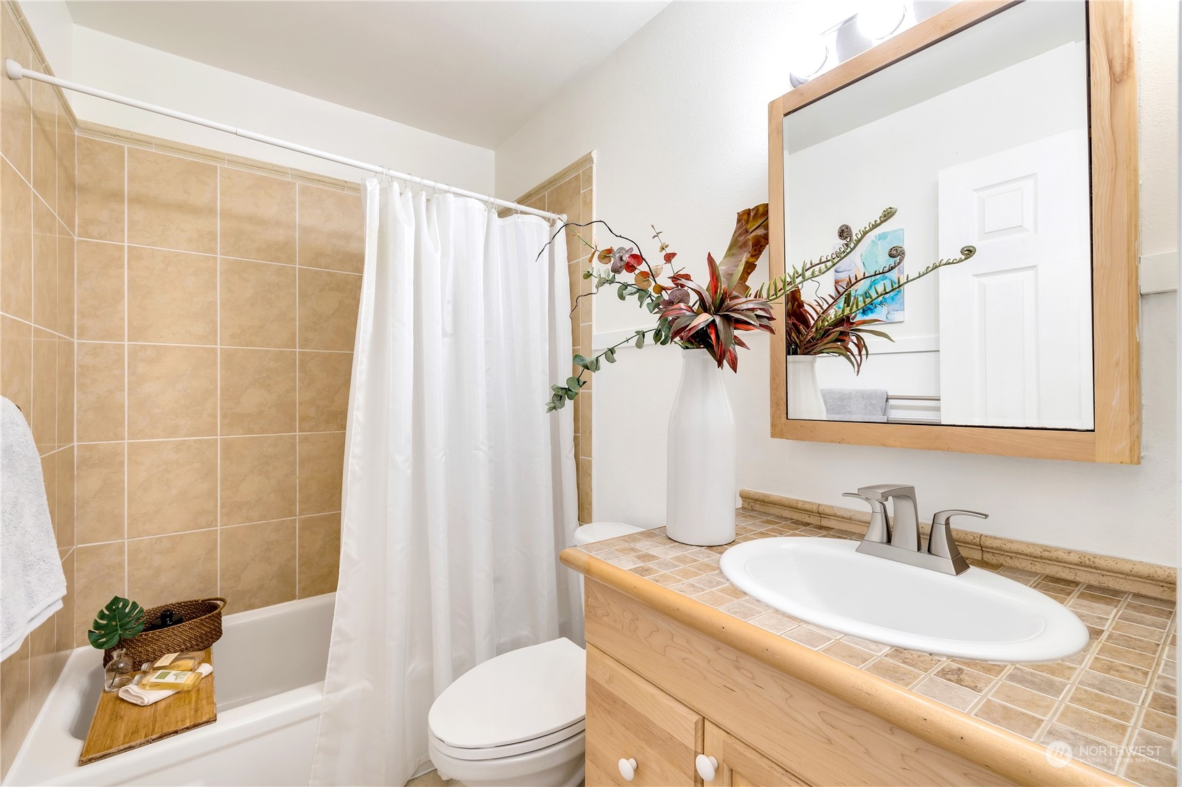 14401 Southeast Petrovitsky Road, Unit B101 Renton, WA 98058 - Photo 10 of 22 a bathroom with a granite countertop sink a toilet and shower