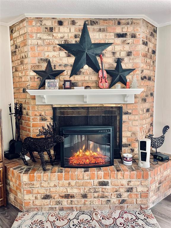 945 Brickyard Road West, TX 76691 - Photo 14 of 25 a living room with furniture and a fireplace