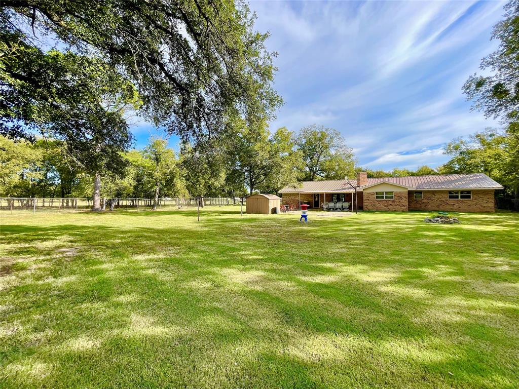 945 Brickyard Road West, TX 76691 - Photo 5 of 25 a front view of a house with a garden