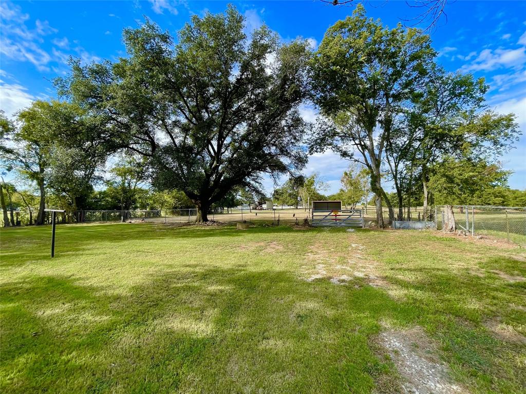945 Brickyard Road West, TX 76691 - Photo 6 of 25 a view of swimming pool with trees