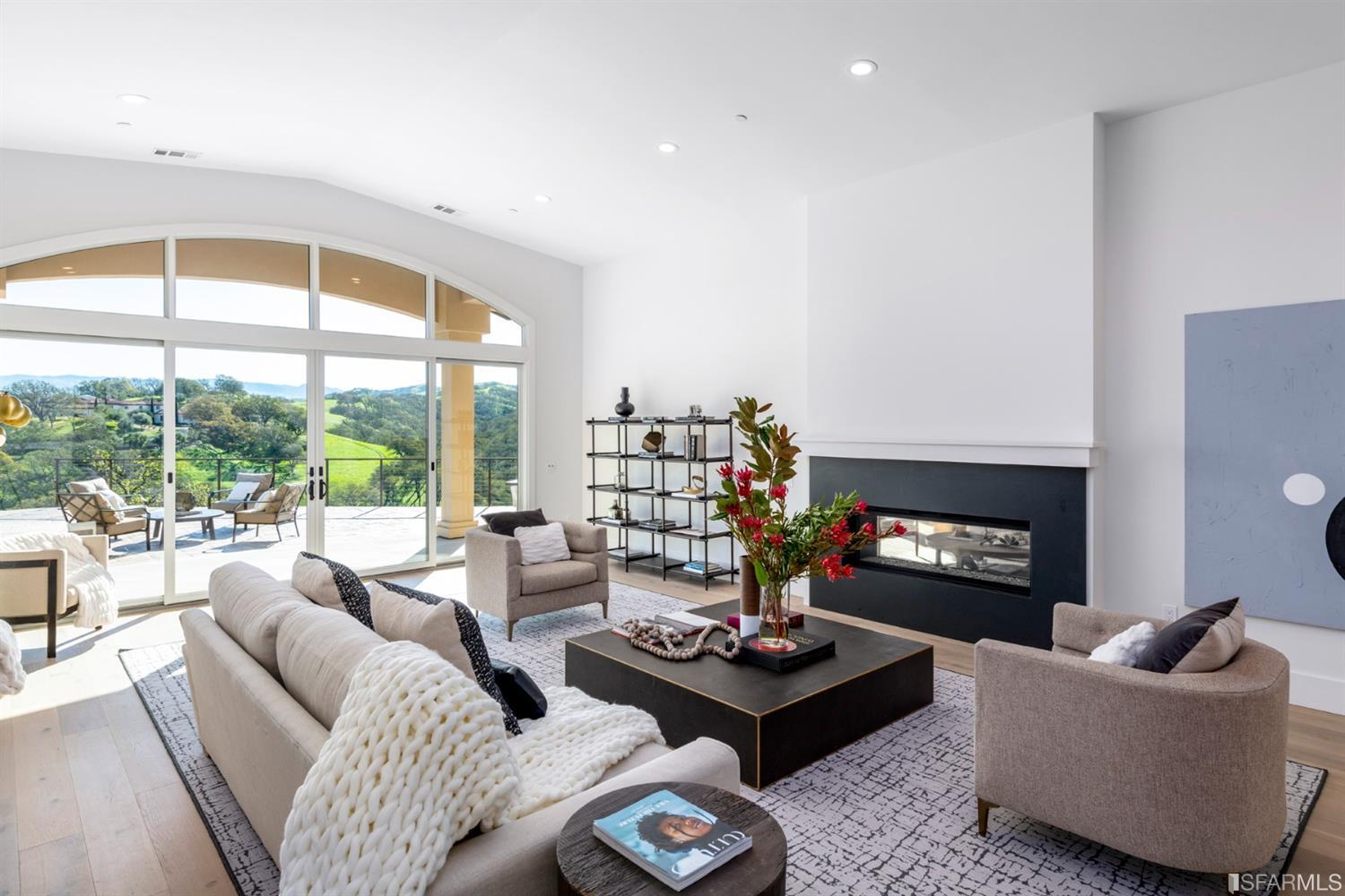 5 Winding Oaks Drive Pleasanton, CA 94566 - Photo 11 of 72 a living room with furniture fireplace and a large window