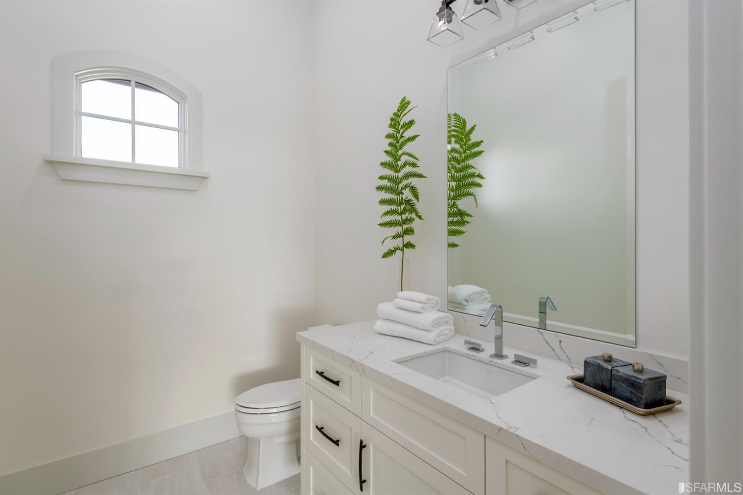 5 Winding Oaks Drive Pleasanton, CA 94566 - Photo 14 of 72 a bathroom with a granite countertop sink a toilet and a mirror