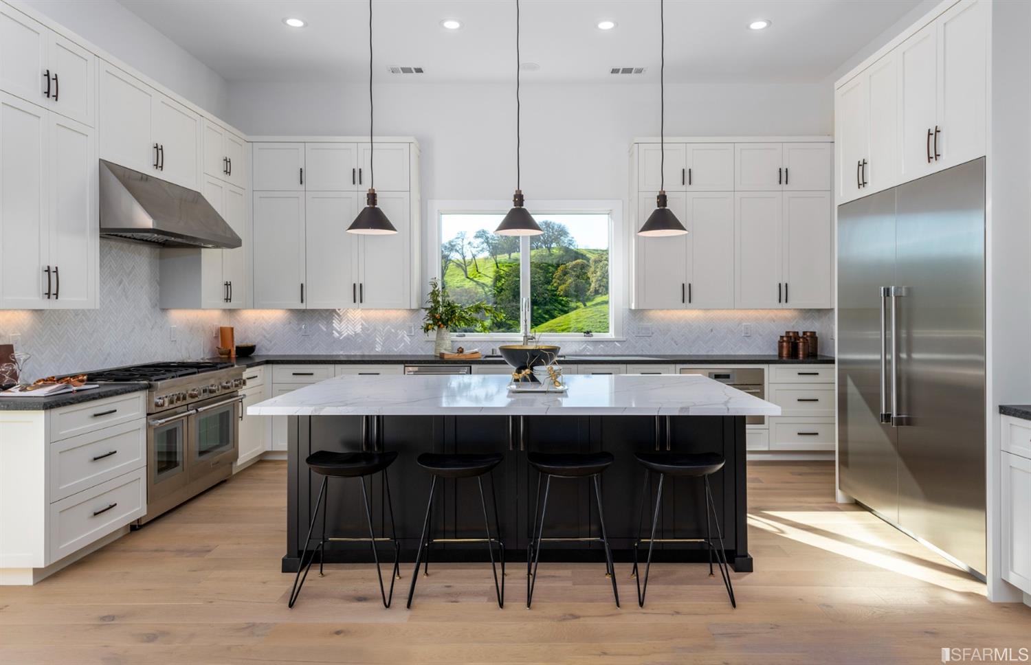 5 Winding Oaks Drive Pleasanton, CA 94566 - Photo 28 of 72 a kitchen with stainless steel appliances granite countertop a sink a stove a refrigerator and island with wooden floor