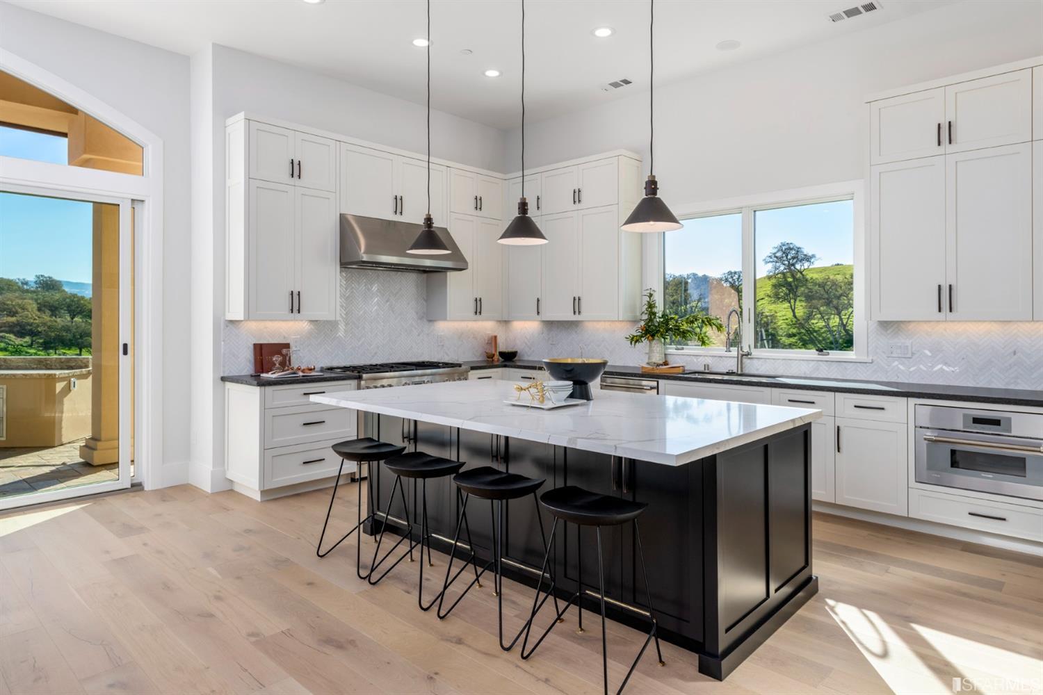 5 Winding Oaks Drive Pleasanton, CA 94566 - Photo 29 of 72 a kitchen with stainless steel appliances granite countertop a sink a stove and a refrigerator