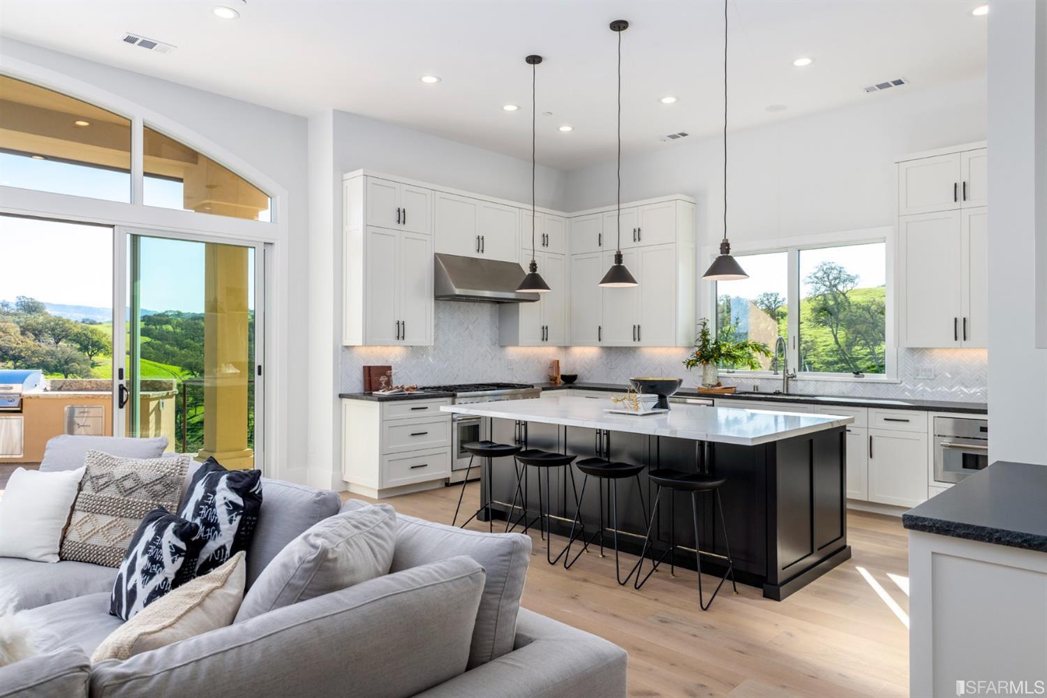 5 Winding Oaks Drive Pleasanton, CA 94566 - Photo 34 of 72 a large kitchen with kitchen island a large window in it