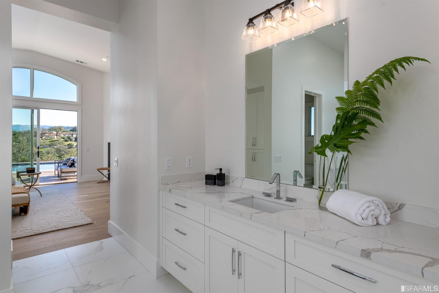 5 Winding Oaks Drive Pleasanton, CA 94566 - Photo 53 of 72 a bathroom with a granite countertop sink and a mirror